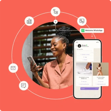 Woman smiling at her phone, with a smartphone screen showing a WhatsApp business account. Icons for communication surround the image.