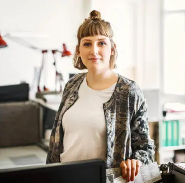 Business woman slightly smiling looking directly into camera
