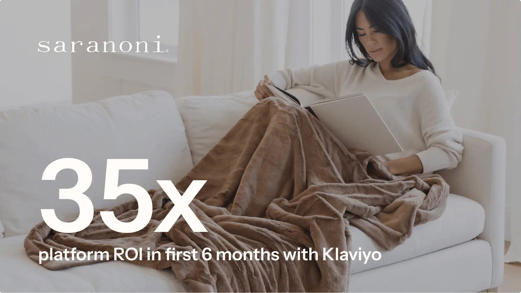 Case study image of a woman reading on a couch, wrapped in a plush blanket, overlaid with "35x platform ROI in first 6 months with Klaviyo" for Saranoni.